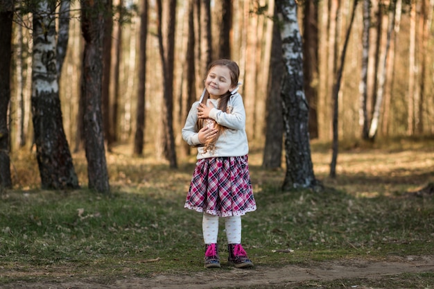 little girl in nature have fun and dance