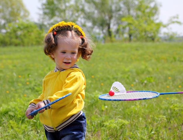 Little girl playing badminton