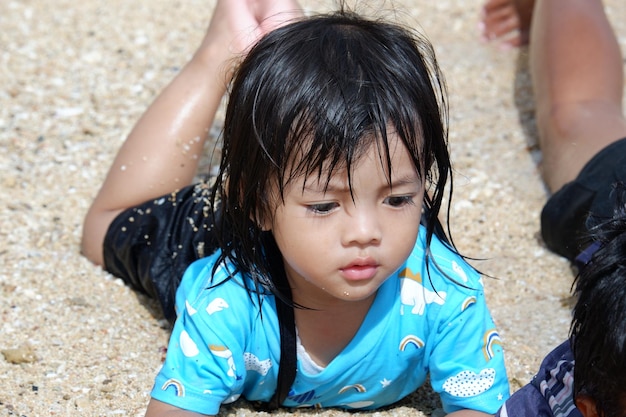 A little girl playing on the beach