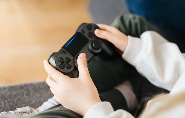 Little girl playing on games console