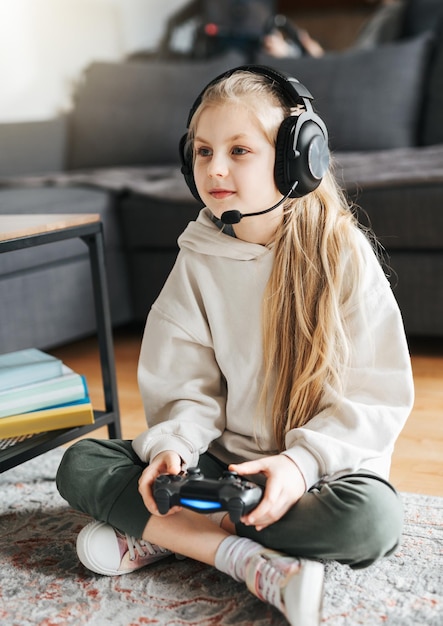 Little girl playing on games console