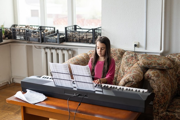 little girl playing the piano in a ruined room.