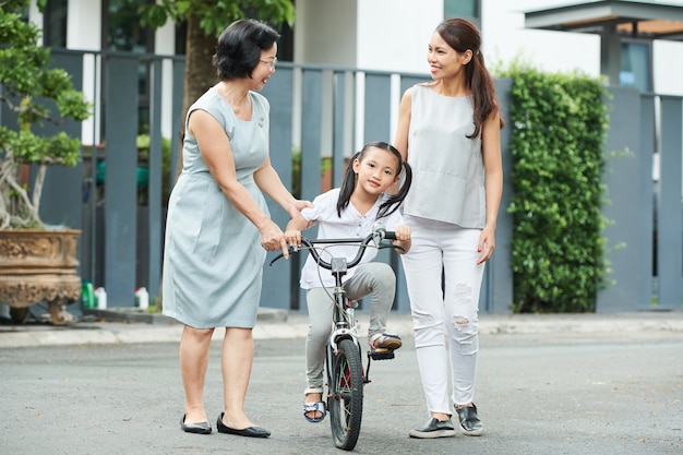 Little girl riding on bicycle