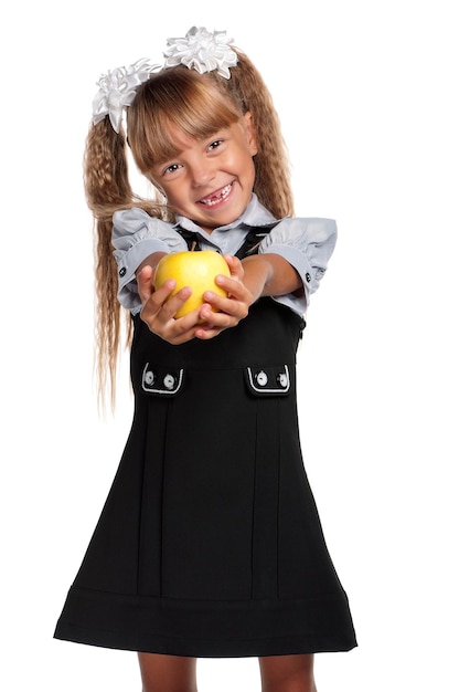 Little girl in school uniform with apple isolated on white background