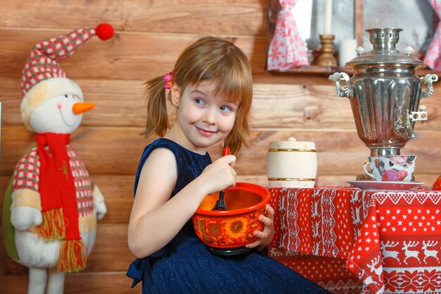 Little girl in a small kitchen