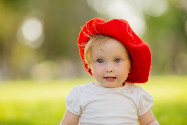 little girl smiling on the green grass