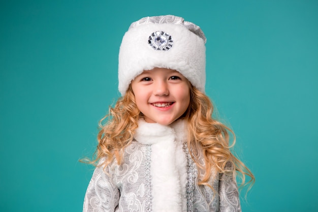 little girl smiling in snow maiden costume