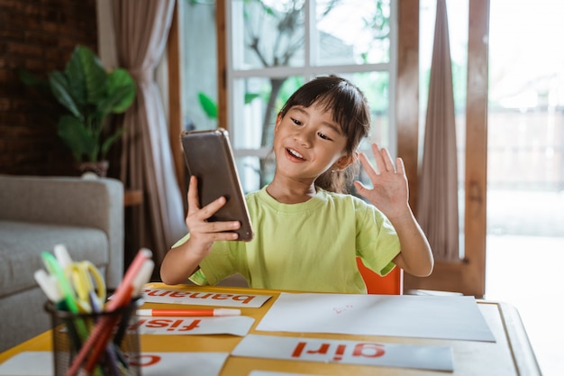 Little girl studying from home