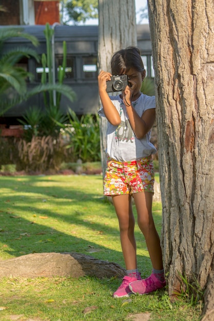 Little girl taking pictures