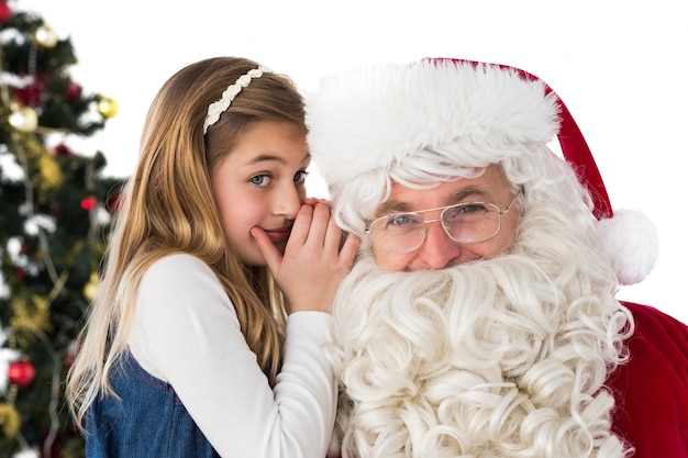 Little girl teling santa claus a secret