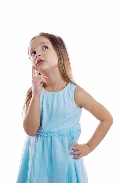 Little girl thinking and looking up, isolated on white background. Thinking emotion .