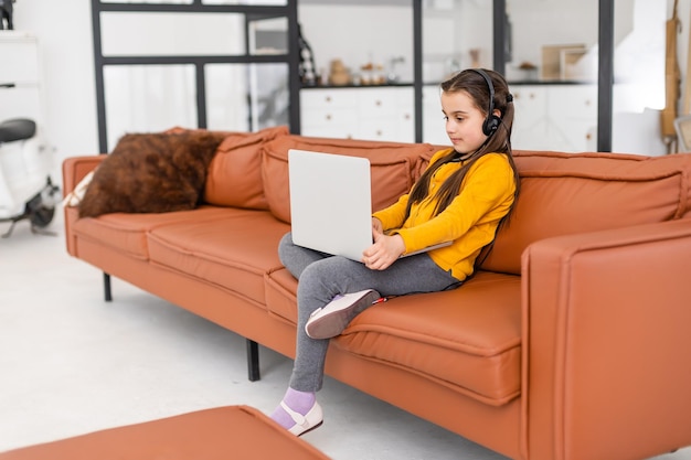 Little Girl Using Digital Laptop E-learning Concept.