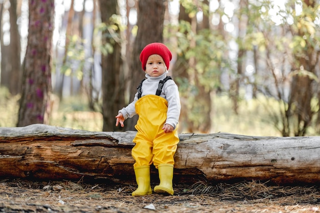 Little girl walking in the forest