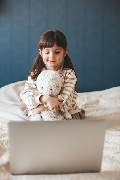 Little girl watching the laptop