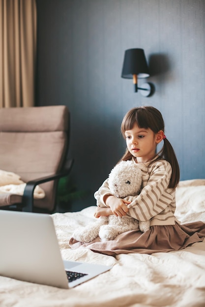 Little girl watching the laptop