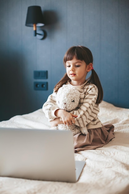 Little girl watching the laptop