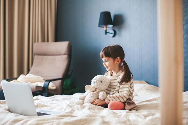 Little girl watching the laptop