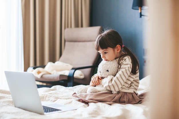 Little girl watching the laptop