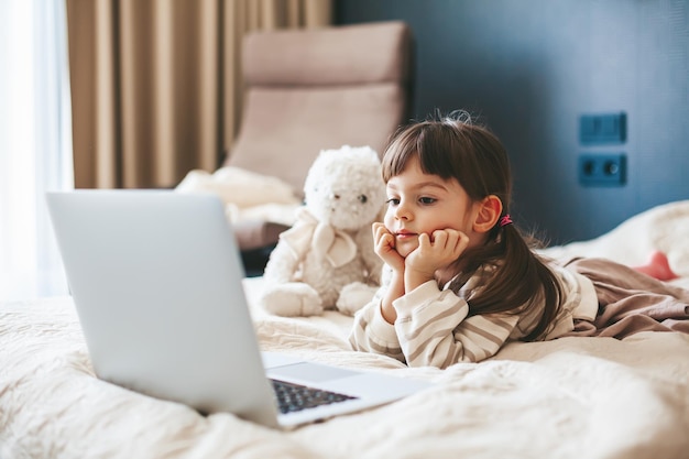 Little girl watching the laptop