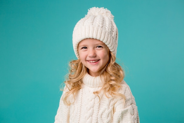 little girl in winter knitted hat and sweater