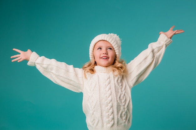 little girl in winter knitted hat and sweater