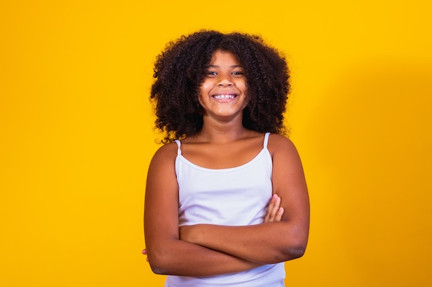 Little girl with African hair smiling at the camera