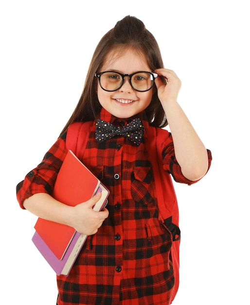 Little girl with backpack and notebooks isolated on white