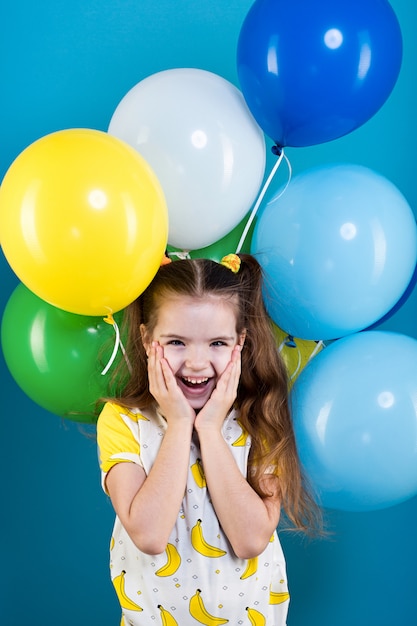 Little girl with baloons