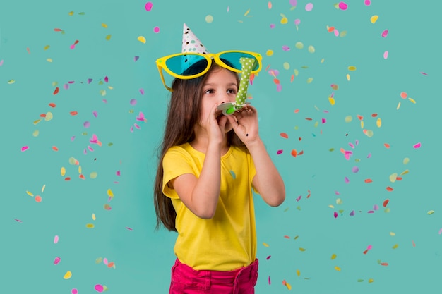 Little girl with big sunglasses and confetti