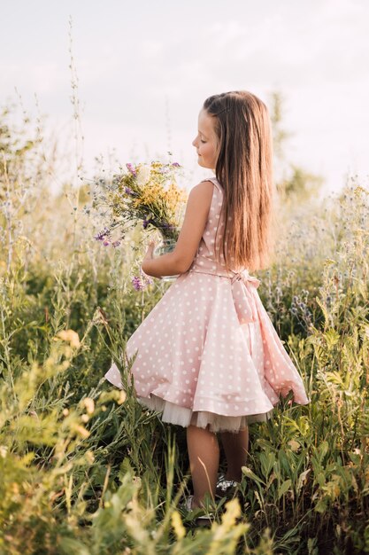 Little girl with flowers