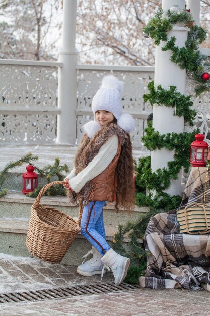 little girl with long hair among the new year decoration