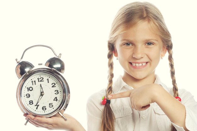 Little girl with a silvered alarm