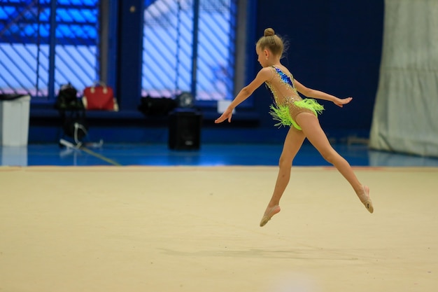 Little gymnast training on the carpet and ready for competitions high quality photo