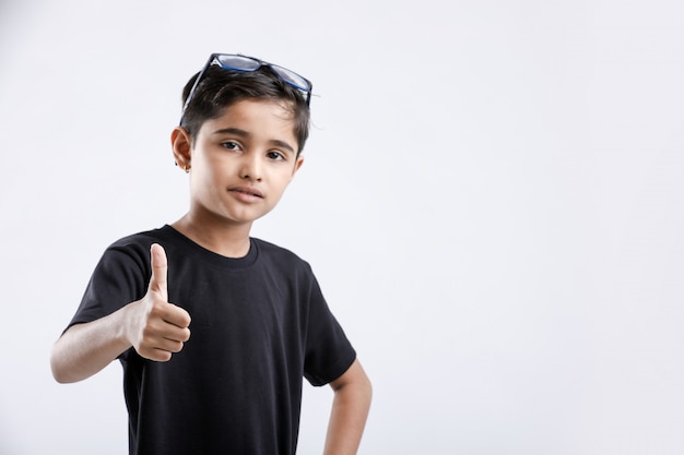 Little Indian / Asian boy showing thumbs up