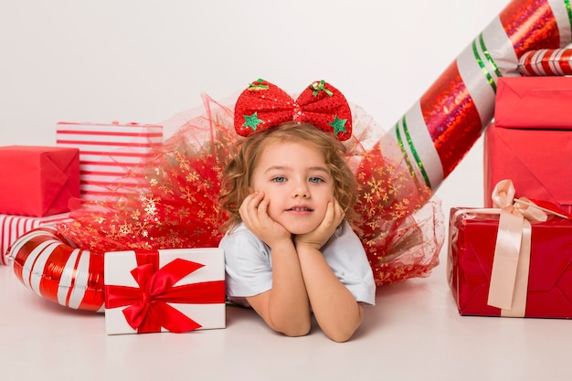 Little kid surrounded by christmas elements