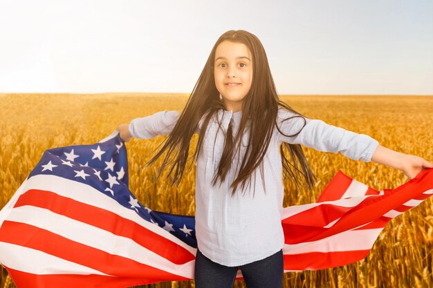 Little kid with the American flag on his back.