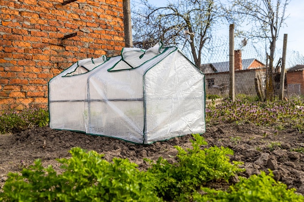 Little mobile film covered greenhouse on ground