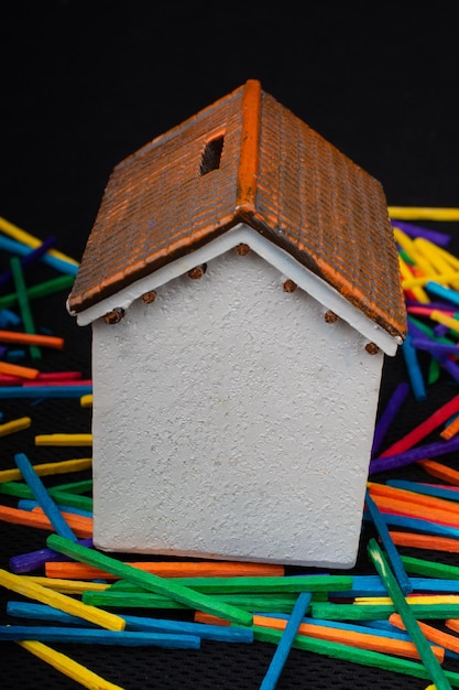 Little model house on little colorful sticks