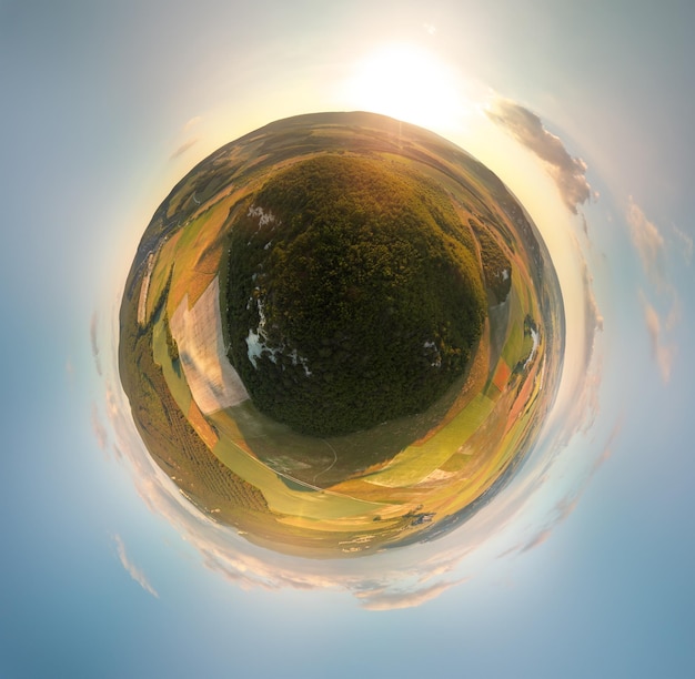 Little planet panorama of mountain and fields