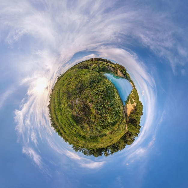 Little planet Spherical view in a field in beautiful evening with nice clouds