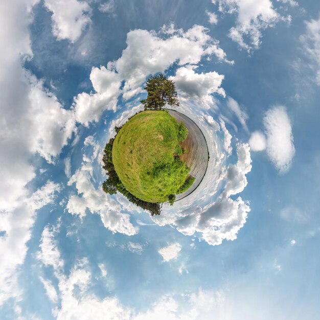 Little planet transformation of spherical panorama 360 degrees Spherical abstract aerial view in field in nice day with awesome beautiful clouds Curvature of space