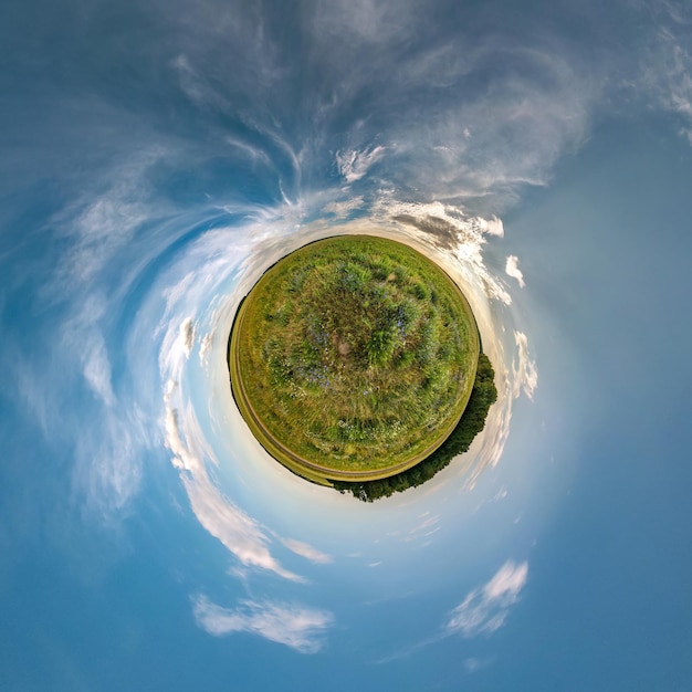 Little planet transformation of spherical panorama 360 degrees Spherical abstract aerial view in field in nice evening with awesome beautiful clouds Curvature of space