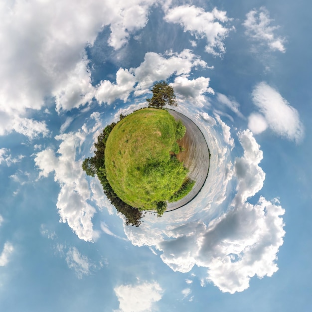 Little planet transformation of spherical panorama 360 degrees Spherical abstract aerial view in field in nice evening with awesome beautiful clouds Curvature of space