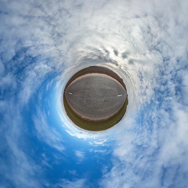 Little planet transformation of spherical panorama 360 degrees Spherical abstract aerial view in field with awesome beautiful clouds Curvature of space