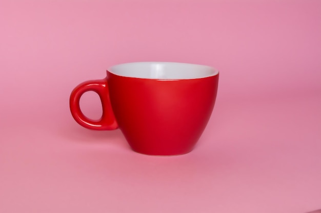 Little red coffee cup on a pink background