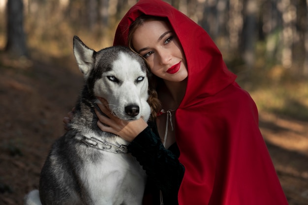 Little red riding hood with adorable husky