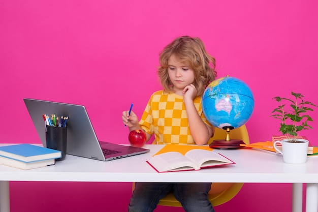 Little student school child isolated on studio background Portrait of nerd student with school supplies