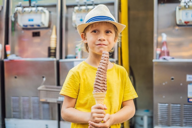 Little tourist boy eating cm ice cream foot long ice cream long ice cream is a popular tourist