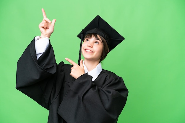 Little university girl over isolated background pointing with the index finger a great idea