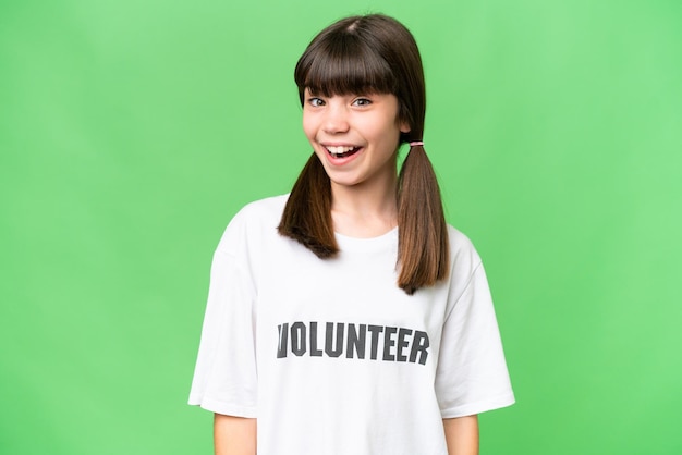 Little volunteer girl over isolated background with surprise facial expression